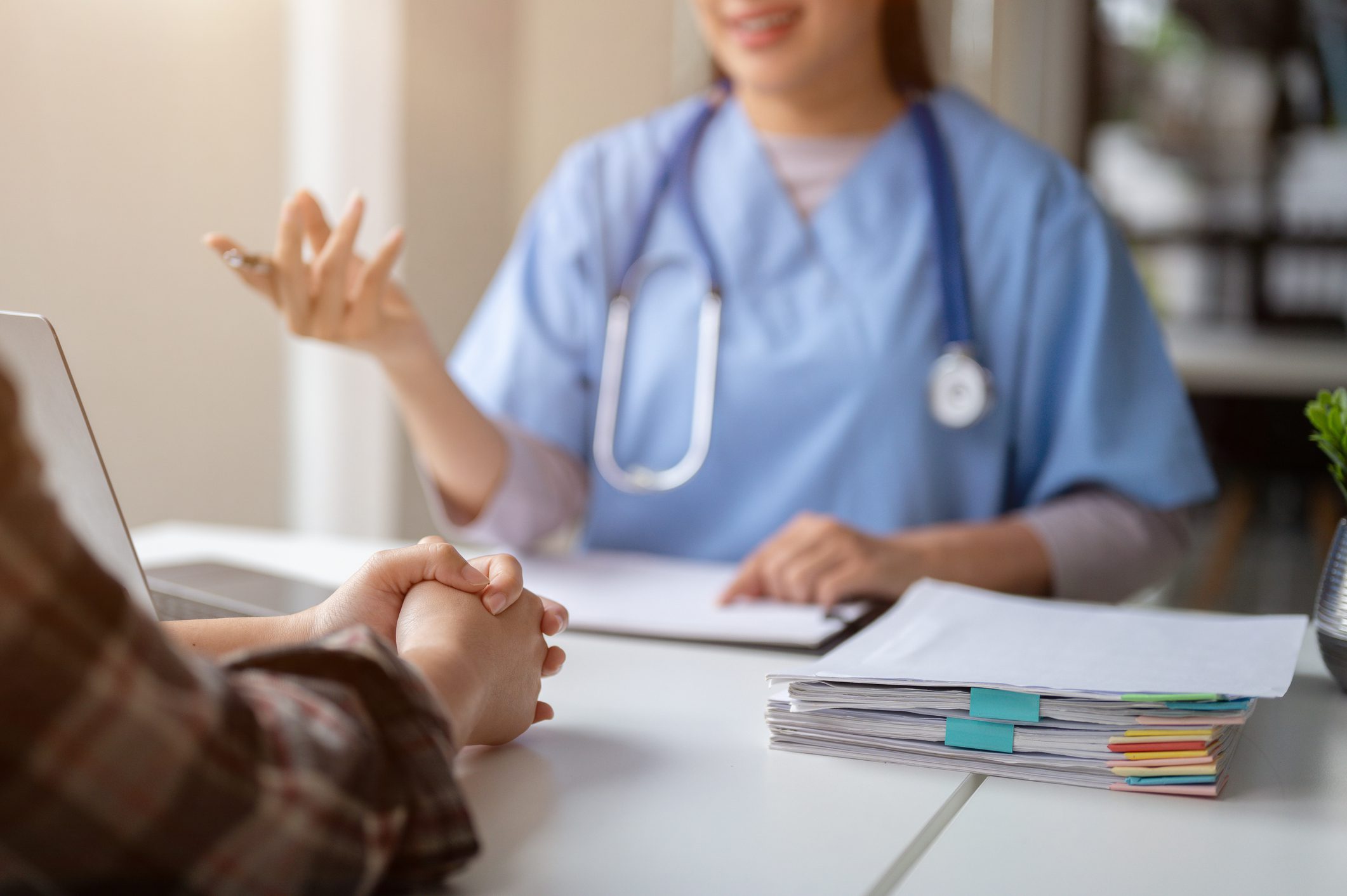 Doctor consulting a patient with attentive care in a medical office.